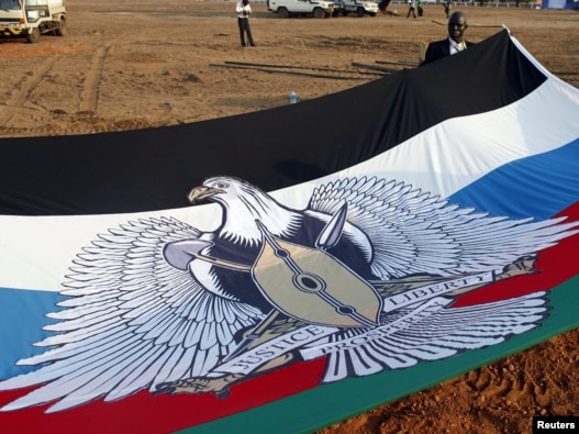 A South Sudanese flag is prepared for South Sudan's Independence Day celebrations in Juba.
