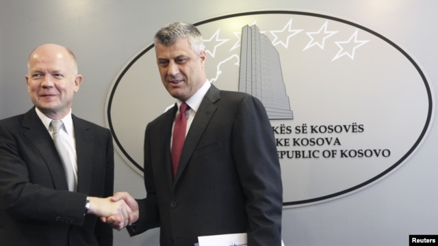 Kosovar Prime Minister Hashim Thaci (right) and British Foreign Secretary William Hague attend a news conference after their meeting in Pristina on October 25.