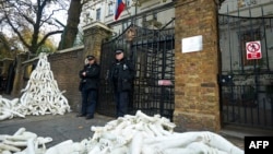 Structures made from white mannequin limbs were piled outside the Russian Embassy in London by protesters on November 3.