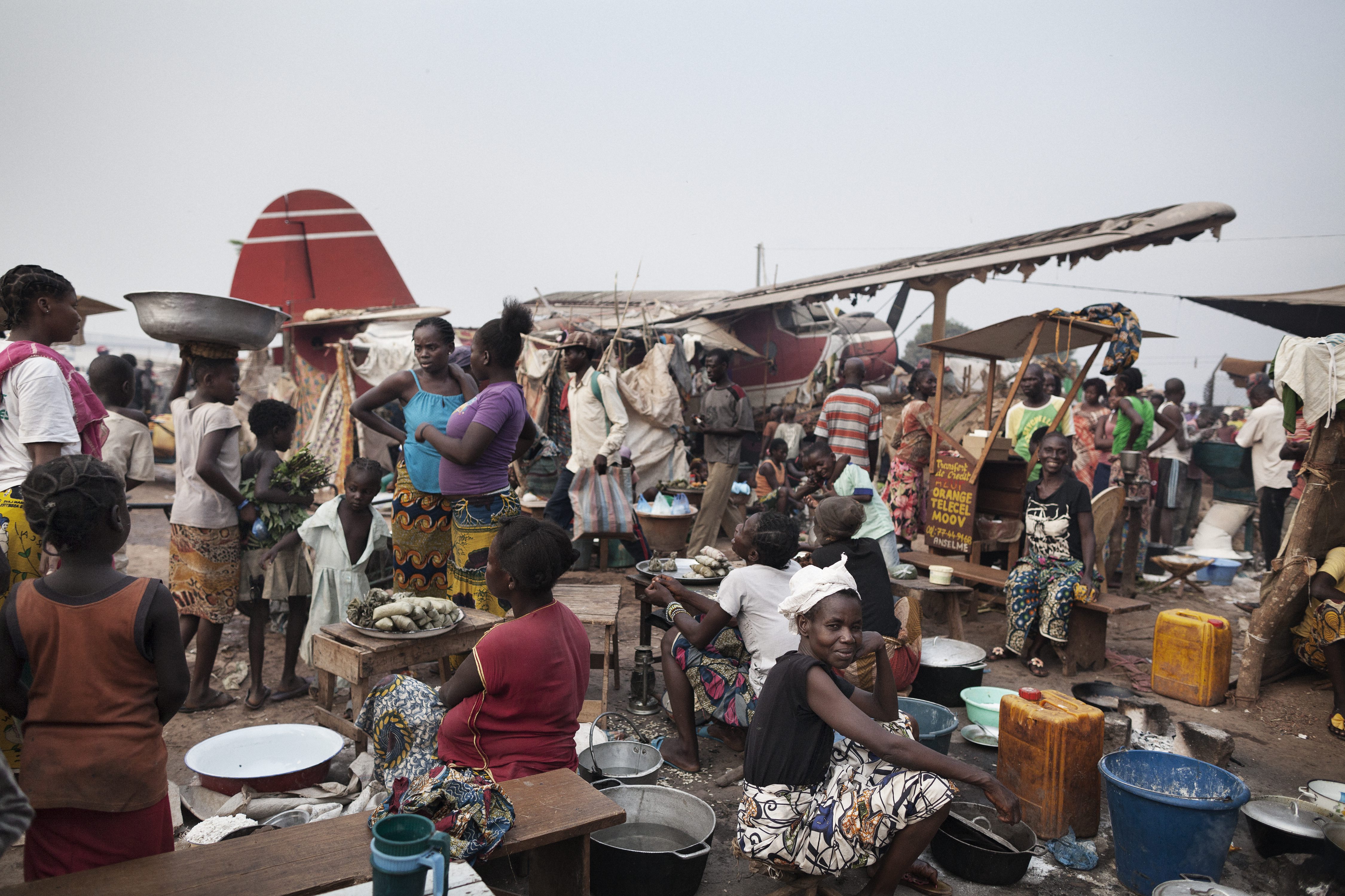 Hundreds of internally displaced people gather at Bangui's M'poko International Airport in the Central African Republic. 