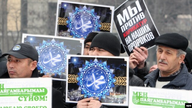 Kyrgyz Muslims hold banners saying 'We love Muhammad' during a rally against the French magazine Charlie Hebdo's satirical cartoons of the Prophet Muhammad in Bishkek on January 20.