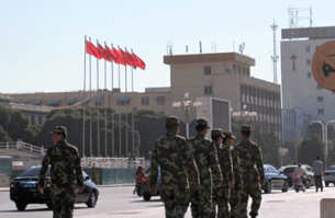 Chinese security forces patrol central Kashgar, Aug. 2, 2011.