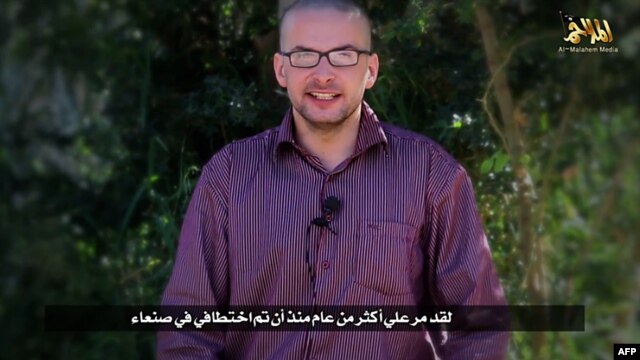 A video grab from a terrorist group's media arm shows U.S. hostage Luke Somers calling for help and saying his life is in danger.