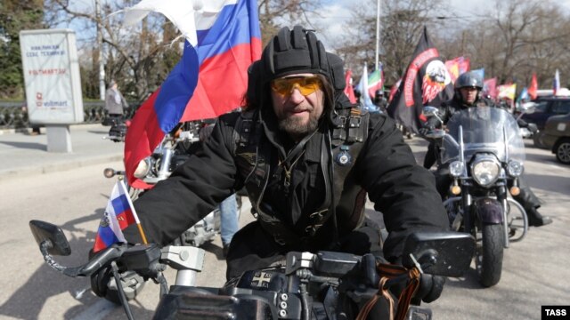 Aleksandr Zaldostanov, leader of the Night Wolves biker group, takes part in a commemoration ceremony for soldiers killed during WWII at the World War II memorial in Sevastopol, Crimea, on March 17.
