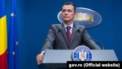 Romanian Prime Minister Sorin Grindeanu says he will remain in office until a new government is installed.