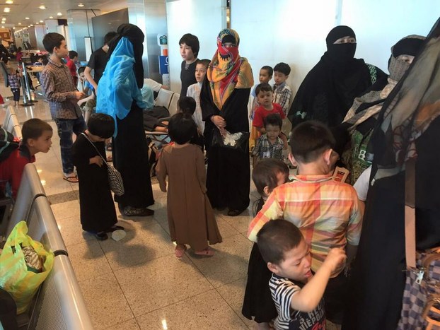 A group of Uyghurs gather at the airport in Istanbul after arriving on a flight from Thailand, June 30, 2015.