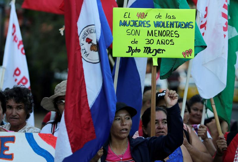 Paraguayan social activists protest in front of the Health Ministry to demand the end of violence against women and better health care for women, as the world celebrates 'International Women's Day' in Asuncion, Paraguay, March 8, 2017. Poster reads: 'Forty-eight percent of raped women are under 30 years of age'.