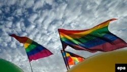 Rainbow flags flutter in the wind as the LGBT activists take part in a rally in support of homosexual and transsexual rights on the International Day Against Homophobia and Transphobia in St. Petersburg on May 17.