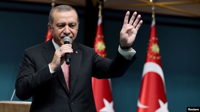 Turkish President Tayyip Erdogan addresses the nation in a live television broadcast from the presidential palace in Ankara on July 21.