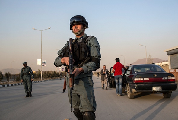 An Afghan National Police officer patrols the streets of Kabul. (Photo: Daniel Berehulak/Getty Images)