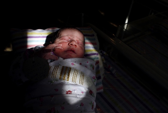 A newborn baby sleeps inside the Neonatal ward at a Kabul hospital. (Photo: Paula Bronstein/Getty Images)