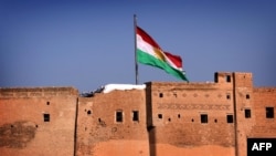 The Kurdish flag flies over the Irbil Citadel in the autonomous Kurdish region of northern Iraq.