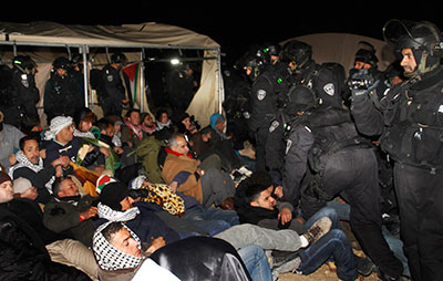 Israeli border police evict Palestinian activists at a campsite near Jerusalem on Friday. (AP/Nasser Shiyoukhi)