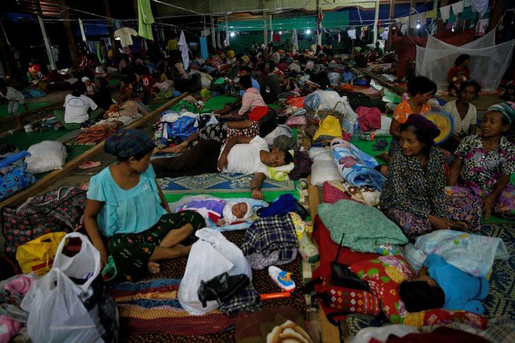 People displaced in the conflict between Kachin Independence Army (KIA) and the Burmese military for the control of an amber mine pass their time at a Christian church in Tanai Township, Kachin State, Burma on June 16, 2017.