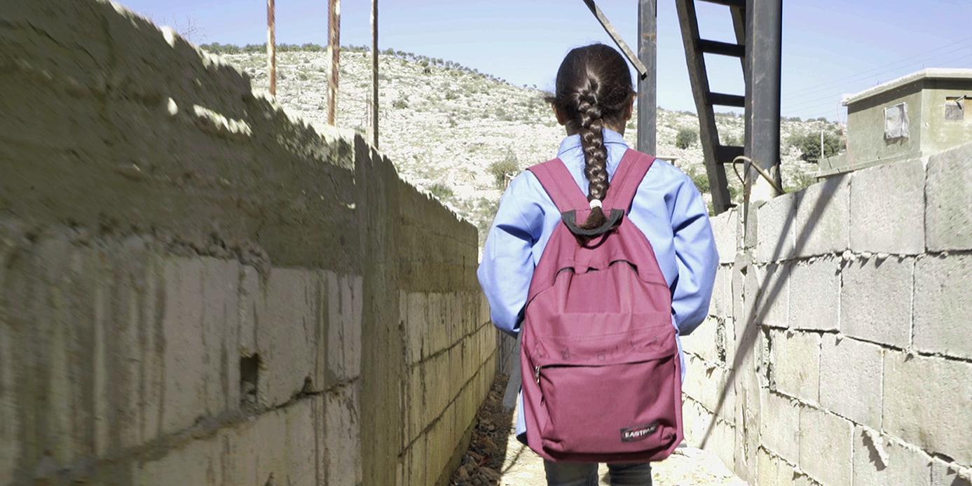 Bara'a, 10, originally from Ghouta, Syria, leaves for school from her informal refugee camp in Mount Lebanon.