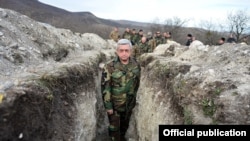 Armenian President Serzh Sarkisian visits a section of the Line of Contact in Nagorno-Karabakh in December.