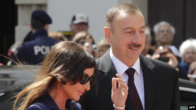 Azerbaijani President Ilham Aliyev (right) and his wife, Mehriban Aliyeva, arrive for a visit to Vienna last month.