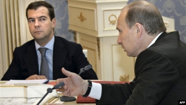 Russian officers claim that Vladimir Putin (right) had to push then-President Dmitry Medvedev to take action after the Georgian Army advanced into South Ossetia in 2008.