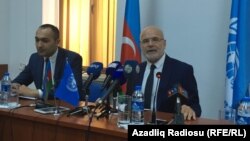 Michel Forst (right), the UN special rapporteur on the situation of human rights defenders, addressing reporters in Baku on September 22.