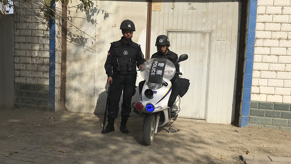 Police officers on duty in the vicinity of a center believed to be used for re-education in Korla city, Xinjiang, Nov. 2, 2017.