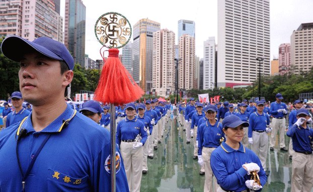 Falun Gong members prepare for a pro-democracy rally in Hong Kong, July 1, 2013.