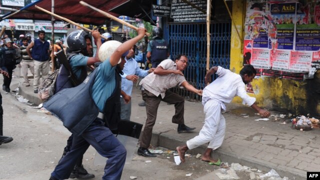 Bangladeshi police baton-charge demonstrators during the clashes in Dhaka on May 5.