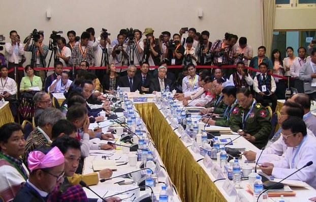Armed ethnic groups meet with government peace negotiators at the Myanmar Peace Center in Yangon, March 17, 2015.