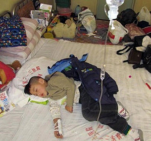 Yang Xinhao receives medical treatment for an illness his parents say was the result of a tainted vaccine, 2011.