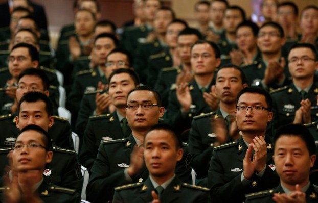 People's Liberation Army cadets clap during a speech in Beijing, Sept. 19, 2012.