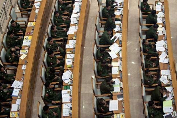 Military representatives attend a parliamentary session in Naypyidaw, Aug. 16, 2013.