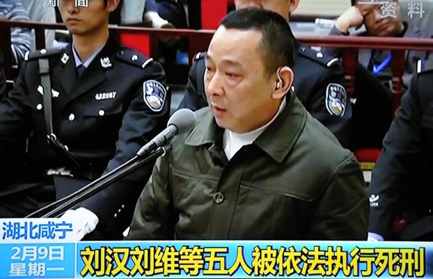 In this TV grab, Liu Han (C) speaks during his verdict hearing at the Xianning Intermediate Peoples Court in Hubei province, Feb. 9, 2015.