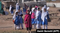 Afghan refugee girls leave school at a refugee camp on the outskirts of Islamabad earlier this year.