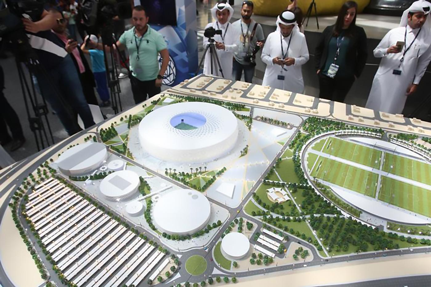 People look at a model of Al Thumama stadium during an unveiling ceremony at Hamad International Airport in Doha, Qatar, August 24, 2017.