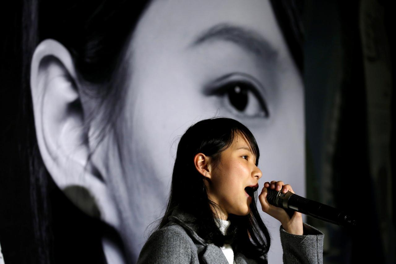 Agnes Chow speaks at a rally after she was banned from running in the upcoming by-elections in Hong Kong, January 28, 2018.