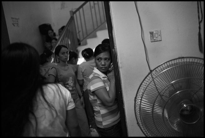 Workers continue to spend long periods waiting at embassy shelters, including the Philippines safe house, shown here. Since 1992, the Kuwaiti government has relied on deportation as the primary method for dealing with domestic workers who face employment-related problems. Workers reported spending weeks or months in official custody, moving from embassy shelters to police stations, and from there to criminal investigation facilities, before they were sent to deportation detention.