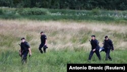 Croatia's police are seen next to the border with Bosnia-Herzegovina in Maljevac, Croatia, on June 18.