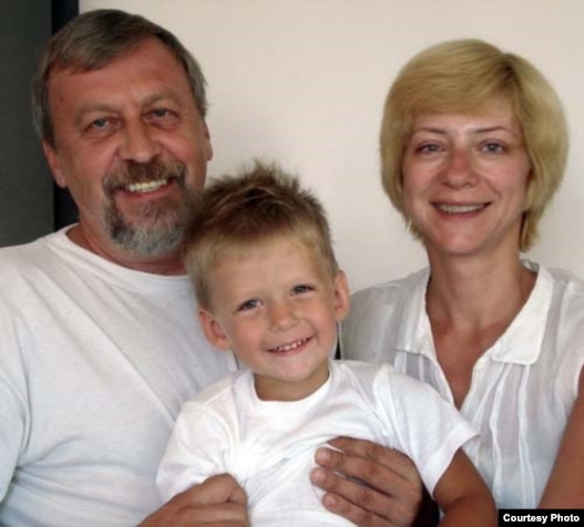 Iryna Khalip (right) with jailed husband Andrey Sannikau and their son Daniil.