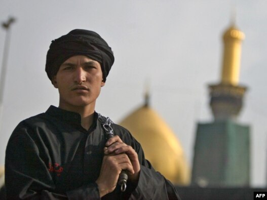 A Shi'ite Muslim in Iraq holds chains used in self-flagellation outside the Imam Hussein shrine during the Ashura observation in Karbala in December 2009.