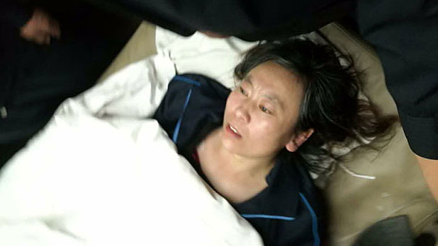 Wang Fengyun is shown after being beaten by police following her first trial in Inner Mongolia's Duolun county, March 14, 2017.