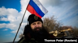 Bratislav Zivkovic, head of the Serbian Chetnik paramilitary group, at a Russian checkpoint in Crimea in 2014.