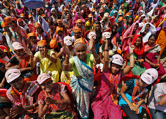 Supporters of India's ruling, Hindu nationalist BJP party greet Narendra Modi, then a candidate for prime minister, at a March 31, 2014, campaign rally in the northeastern state of Assam. (Reuters)