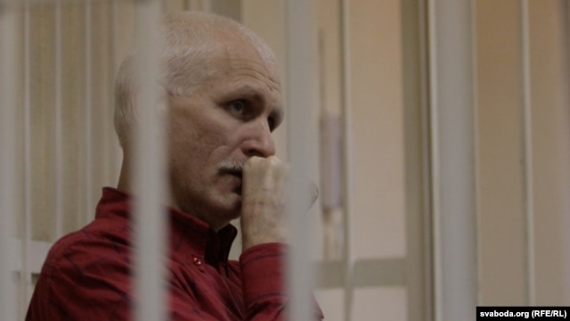 Ales Byalyatski sits in a Minsk court during his trial in November 2011.