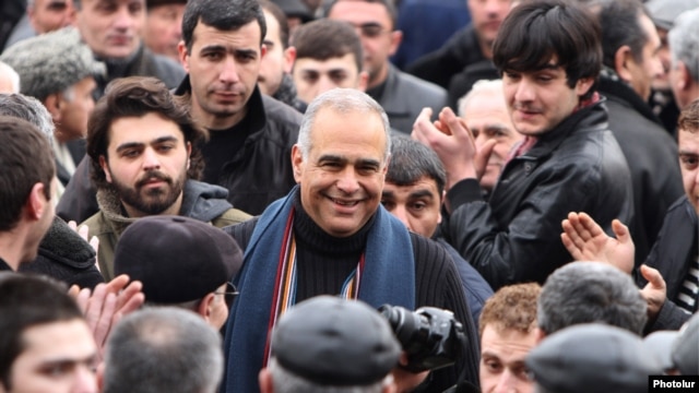 Opposition leader Raffi Hovannisian is greeted by supporters in Yerevan's Liberty Square on February 22