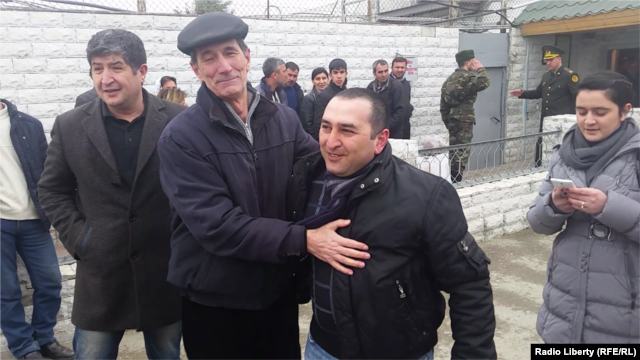 Basir Suleymanli (second from right), who heads an election-monitoring NGO, after his release from prison under President Ilham Aliyev's clemency decree on March 19.