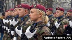 Members of the police forces of Republic of Srpska march during a parade marking the 26th anniversary of the Republic of Srpska in the Bosnian town of Banja Luka on January 9/