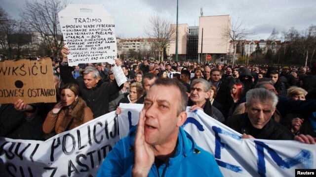 Antigovernment protesters rally in front of a government building in Sarajevo on February 10.