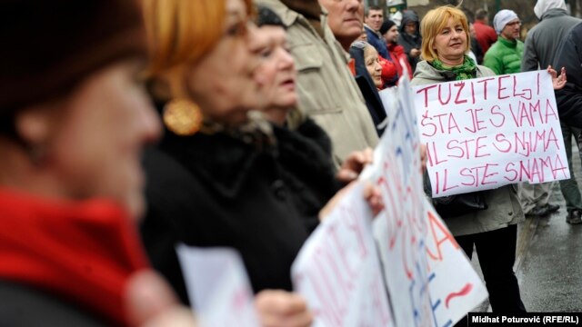 Demonstrators rally in front of the federal parliament building in Sarajevo on February 12, as protests over unemployment, corruption, and political paralysis enter their second week.