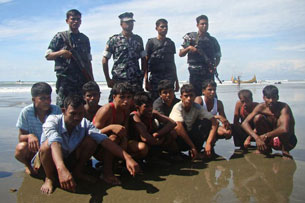 Rohingya survivors are seen in the custody of Bangladeshi border guards in Teknaf, Nov. 7, 2012.