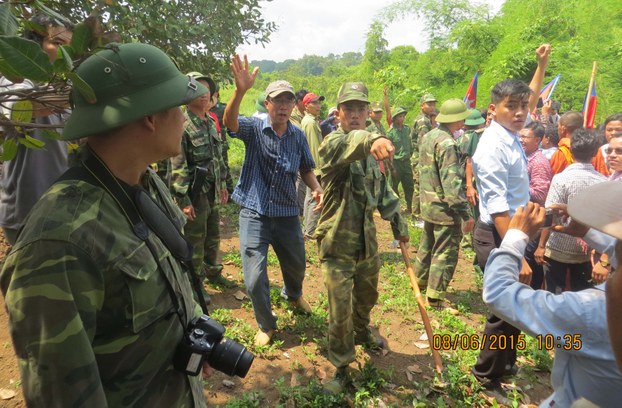 Cambodian opposition lawmakers and activists confront Vietnamese soldiers and villagers at the border in Ratanakiri province, June 8, 2015.