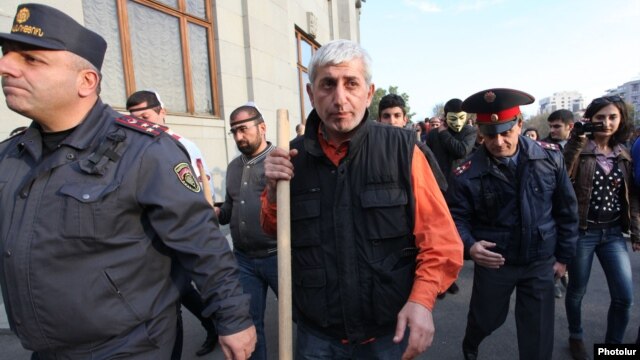 Opposition activist Shant Harutiunian leads an antigovernment demonstration from Yerevan's Liberty Square on November 5.